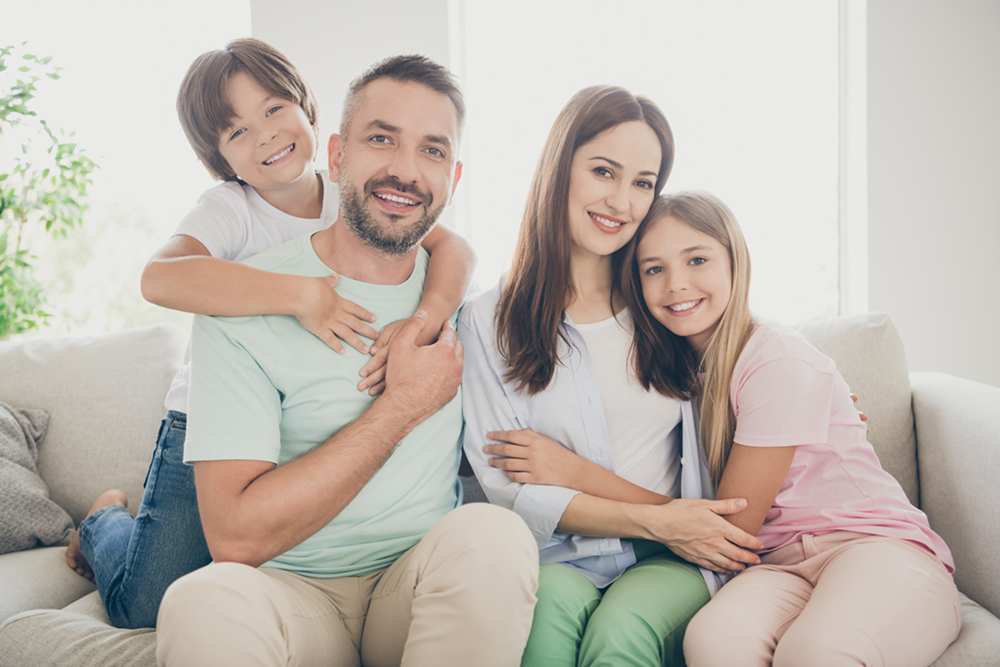 Smiling family representing dental care for the whole family
