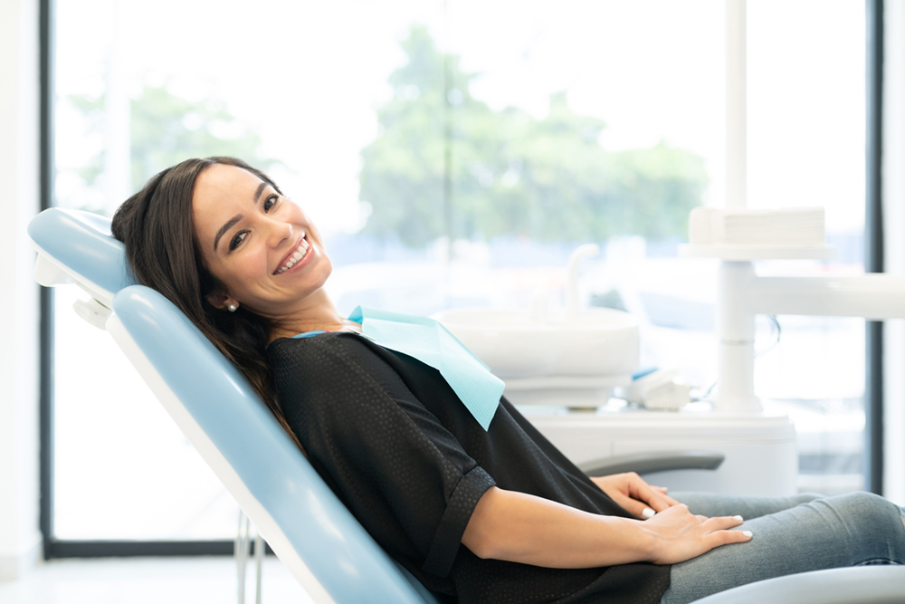 Female dental patient lying in a dental chair